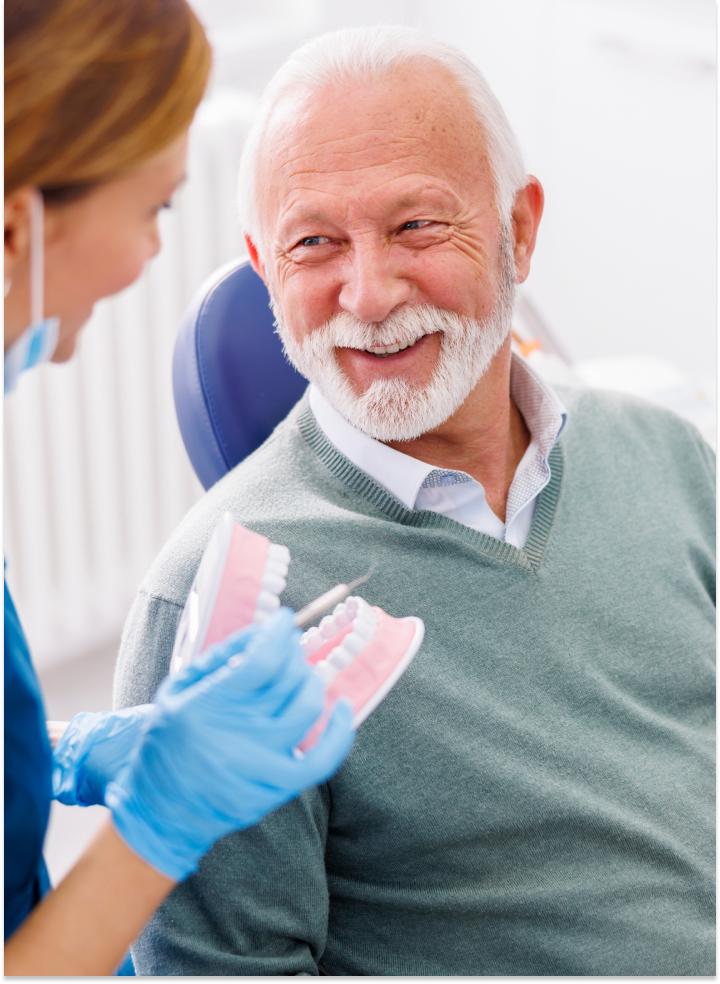 Dentist showing patient teeth