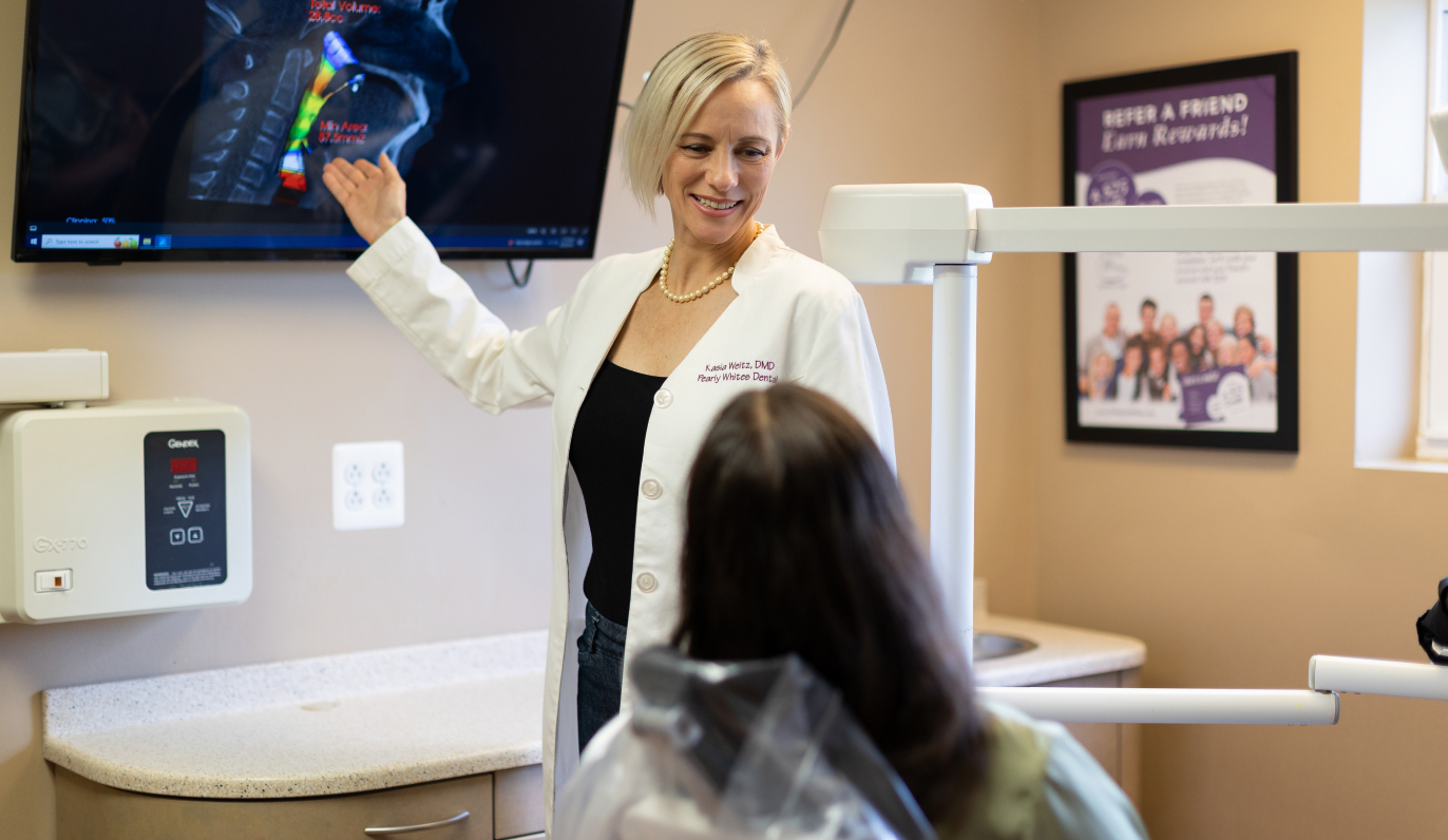 Dr. Weitz showing a patient an x-ray.